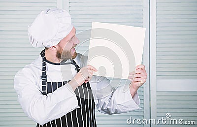 Book written by me. Book by famous chef. Improve cooking skill. Book recipes. According to recipe. Man bearded chef Stock Photo