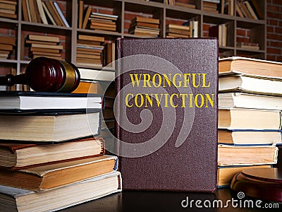 Book about Wrongful conviction and gavel. Stock Photo