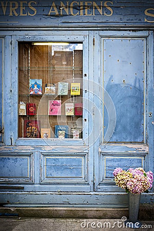 SAINT-MALO, FRANCE. Bookcase with wooden facade of ancient books with a retro charm. Editorial Stock Photo