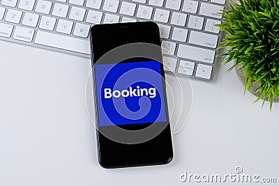 Booking.com app logo on a smartphone screen. Editorial Stock Photo