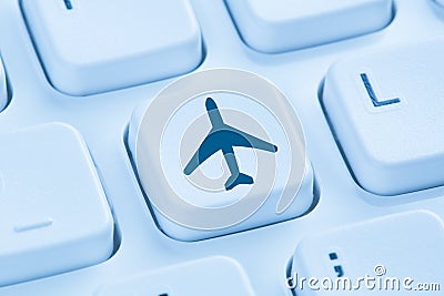 Booking flight holidays vacation online shopping e-commerce internet travel shop blue computer keyboard Stock Photo
