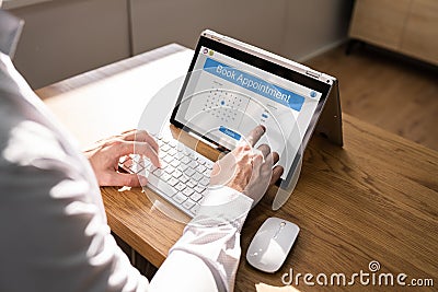 Booking Meeting Appointment On Laptop Computer Stock Photo