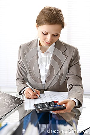 Bookkeeper woman or financial inspector making report, calculating or checking balance. Business portrait. Copy spac Stock Photo