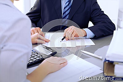 Bookkeepers or financial inspector making report, calculating or checking balance. Audit concept. Stock Photo