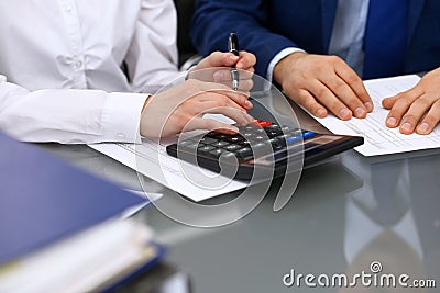Bookkeepers team or financial inspectors making report, calculating or checking balance. Tax service financial documen Stock Photo
