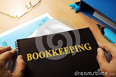 Bookkeeping written on a note. Stock Photo