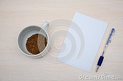 booklet, pencil and coffee cup on vintage wood background. Responsive design mockup Stock Photo