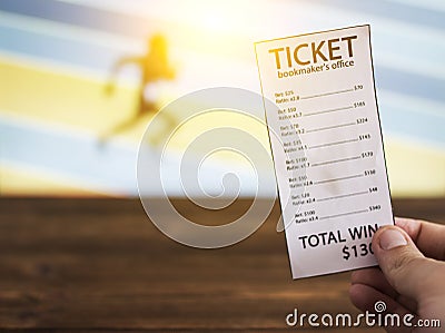 Bookmaker ticket on the background of the TV, which shows athletics, running, jumping, sports betting, Bookmaker ticket Stock Photo