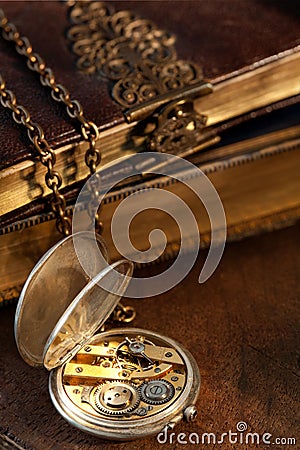 Books and antique pocket watch Stock Photo