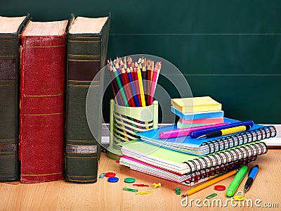 Books and blackboard. School supplies. Stock Photo