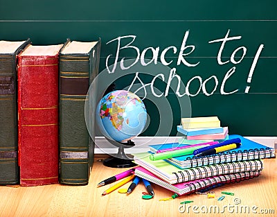 Books and blackboard. School supplies. Stock Photo