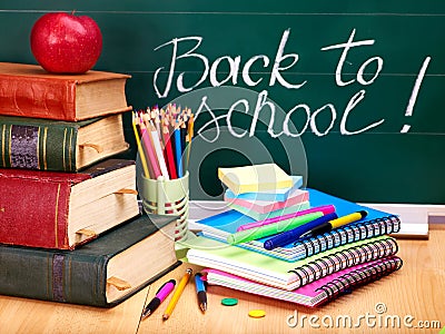 Books and blackboard. School supplies. Stock Photo