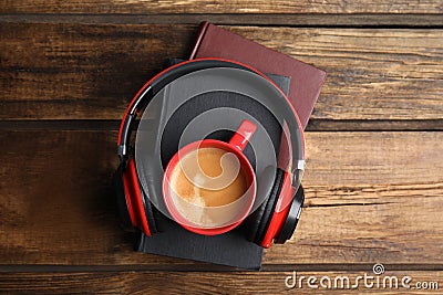 Books, coffee and headphones on wooden table, top view Stock Photo