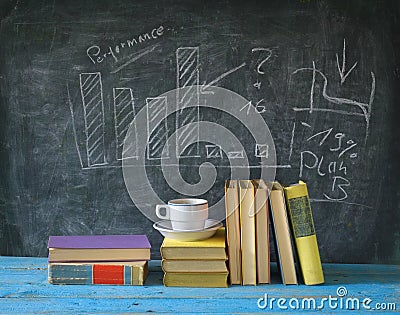 Books, cup of coffee, blackboard, diagram Stock Photo