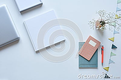 Books on desktop white design pastel highlights Stock Photo