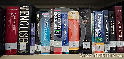 Books/dictionaries of different languages in a library. Old language books at display. Oxford American Dictionary for Learners of Editorial Stock Photo