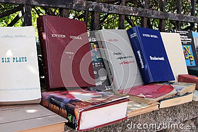 Books by and about Enver Hoxha on sale at a street stall outside the late dictator`s former residence in Tirana, Albania Editorial Stock Photo