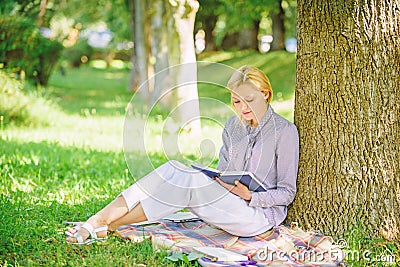 Books every girl should read. Relax leisure an hobby concept. Best self help books for women. Girl concentrated sit park Stock Photo