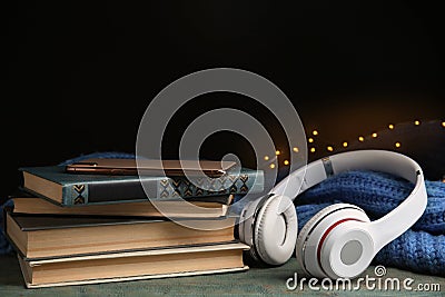 Books, headphones and mobile phone on blue wooden table Stock Photo