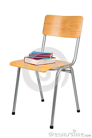 Books on school chair isolated on white Stock Photo