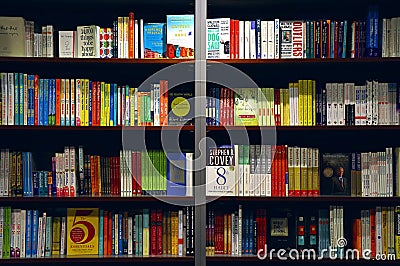 Books on shelves Editorial Stock Photo