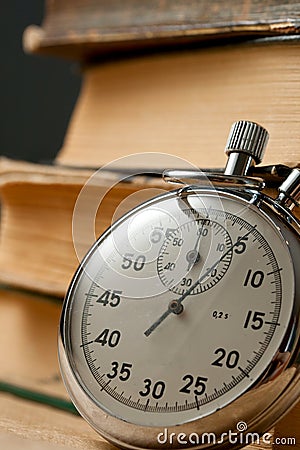 Books and stopwatch Stock Photo