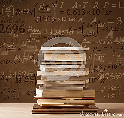 Books on vintage background with math formulas Stock Photo