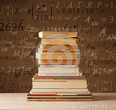 Books on vintage background with math formulas Stock Photo