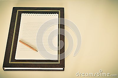 A books on a white background with a pensil Stock Photo