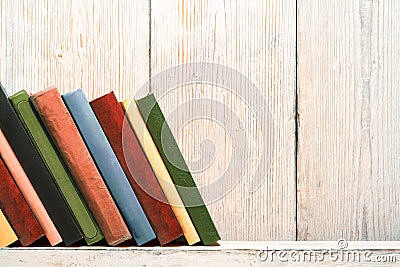 Books Wood Shelf, Old Spines Covers, White Wooden Wall Stock Photo