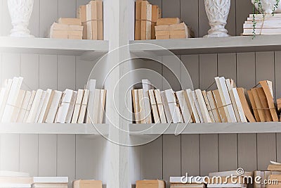 Bookshelf is white book with wooden white shelf. Stock Photo