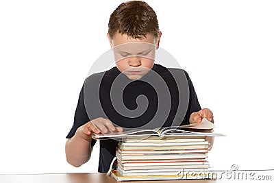 Bookworm reading a pile of books Stock Photo