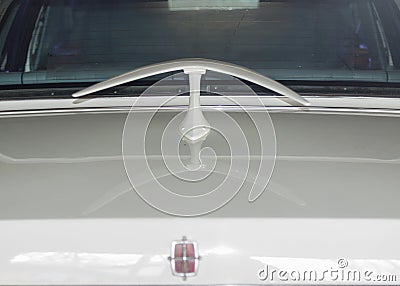 Boomerang shaped spoiler on white classic Lincoln car in landscape Stock Photo