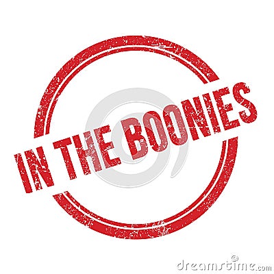 IN THE BOONIES text written on red grungy round stamp Stock Photo