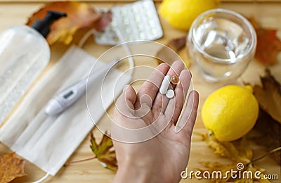 Boost immune system in autumn flu season or coronavirus. Vitamin D, C and zinc pills in hand Stock Photo