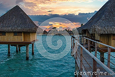 Sunset - Overwater hotel rooms at Bora Bora Tahiti Stock Photo