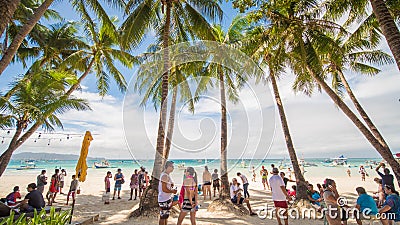 BORACAY, PHILIPPINES - JANUARY 7, 2018 - Tourists relaxing on the paradise shore of the White Beach in Boracay Editorial Stock Photo