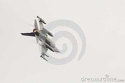 A Romanian military jet pilot flies his F16 Falcon during a demonstration following the opening ceremony for the European F-16 Editorial Stock Photo