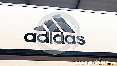 Adidas logo sign and text brand interior of sporty shop shoes of sport footwear Editorial Stock Photo