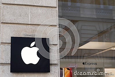 Apple logo brand and sign fruit front of phone pad and tech shop Editorial Stock Photo