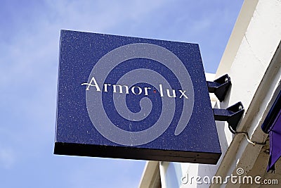 Armor Lux sign text and brand logo on wall boutique fashion shop marine sea ocean Editorial Stock Photo