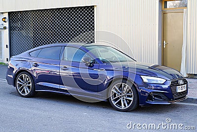 Audi A5 modern blue new car parked in french street Editorial Stock Photo