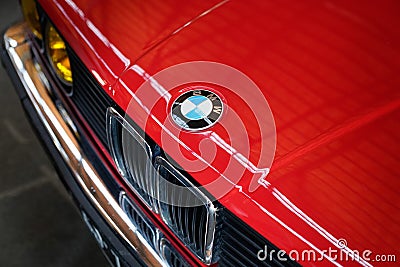 BMW logo brand sign on old timer vintage retro front car hood face Editorial Stock Photo