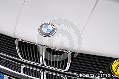 BMW logo brand text and logo sign on old timer vintage retro front car hood face Editorial Stock Photo