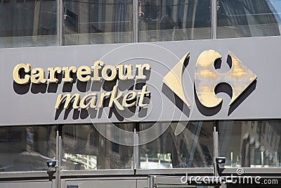 Carrefour market store chain brand sign and logo wall facade on supermarket shop Editorial Stock Photo