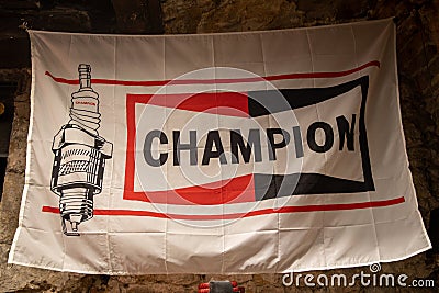 champion spark plugs logo brand and text sign on old advertising flag vintage car Editorial Stock Photo