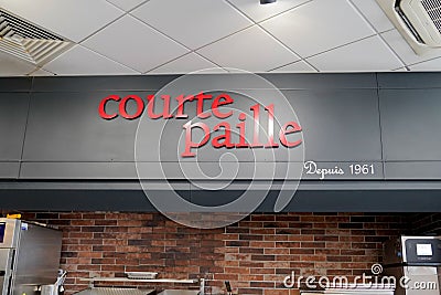 Courtepaille grill brand text and sign logo on interior wall restaurant Editorial Stock Photo