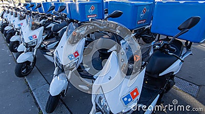 Dominos motorcycle pizza text sign of deliver Domino`s pizza chain brand with deliver Editorial Stock Photo