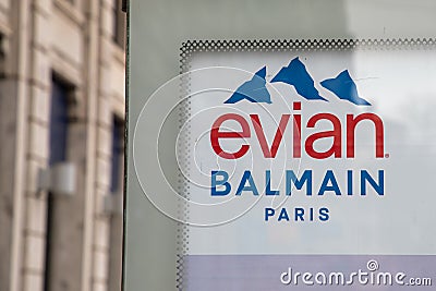 Evian Natural Mineral Water logo text and Balmain paris sign brand in french Editorial Stock Photo