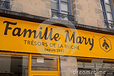 Famille Mary logo text store and brand bee sign on facade wall boutique beekeeper shop Editorial Stock Photo